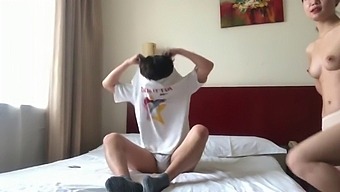 Intimate Encounter Of A Chinese Couple In A Hotel Room